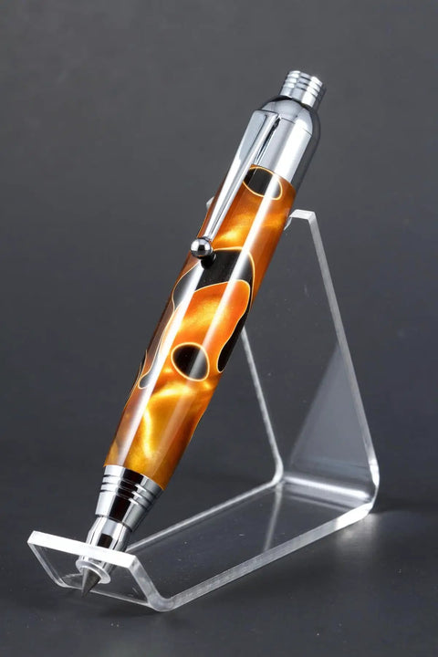 Top Shelf Chrome Woodturning Hardware Kit Pencil And Pen Project Set Three Piece Collection displaying a chrome pen on a clear stand.
