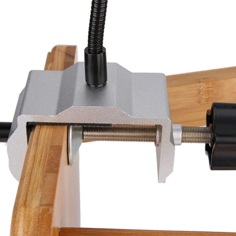 Close-up of Beefy Flexible Metal Arm Soldering Clamp with Adjustable Multi Angle Stand clamping a wooden surface for stability.