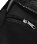 Close-up of zipper on On The Go Golf Swing Trainer Bag For Quick Practice Sessions Power Smash Target Bag in black pattern.