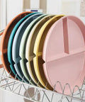 Five Pack 9 Inch Unbreakable Portion Control Plates With Three Compartments Reusable BPA Free Dinner Plates on a drying rack