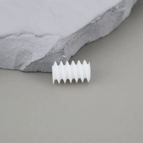 Close-up of a white 10mm worm gear from the 50 Pack 6mm Plastic Cog Gears Set 0.5 Module 10mm Worm Gears for 2mm Motor Shafts