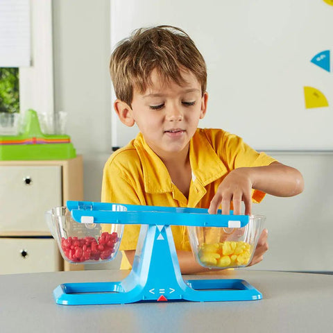 Child using Blue Nestable Double Bucket Balance Scale For Liquids And Solids, Clear Weighing Balance For Classroom, Easy To Assemble