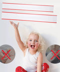 Child smiling and holding up Totally Pinch Proof Door Guard And Protector Set For Kids, safety product for little fingers.