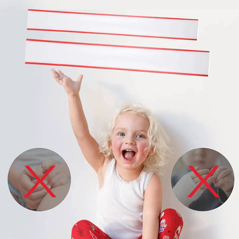 Child smiling and holding up Totally Pinch Proof Door Guard And Protector Set For Kids, safety product for little fingers.