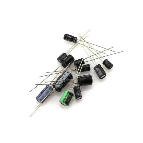 A scattered arrangement of capacitors from the 120 Piece Aluminum Electrolytic Capacitor Kit With 12 Common Values From 0.22uF To 470uF For DIY Electronics Projects A Handy Kit For Hobbyists And Pros Versatile Assortment For Circuits And Repairs.