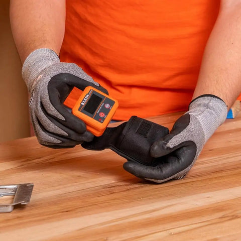 Person using Angle Finder Digital Gauge With Strong Magnetic Base For Quick Conversions Between Degrees, Percent Grade, Inches Per Foot And Millimeters Per Meter, Doubles As Digital Level And Relative Angle Checker For Framing, Landscaping, And Slope Work on workbench.