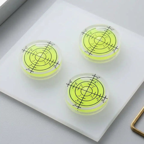 SILENRADAWN Small Circular Bubble Levels 3 Piece Round Spirit Level Layout featuring three compact, clear bubble levels with yellow markings.