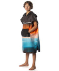 Child wearing Kids Hooded Changing Poncho Towel For Beach And Pool Microfiber Quick Dry Swim Poncho with stripes and front pocket