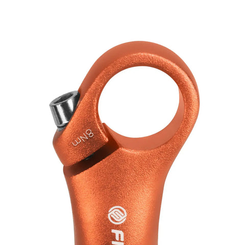Close-up of orange aluminum MTB bar ends with 6061 T6 lightweight extenders and ergonomic bend for mountain bikes.