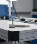 Heavy Duty Spring Indexing Plunger With Rugged L Handle For Snappy Manual Retraction, carbon steel positioning pin on a workbench.