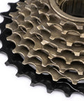 Close-up view of Beefy 8 Speed 13 To 28T Bicycle Freewheel With Threaded Freehub Replacement Part For Road And Mountain Bikes Brass Black Finish