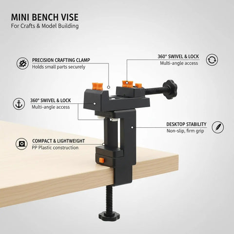 Mini Desktop Vise For Crafts And Jewelry Making, Tiny Bench Clamp For Model Building, Durable Plastic Workholding Tool With Secure Grip On Black Color on a wooden desk.