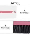 Detail view of the Heavy Duty Pink Broom With Extended Handle showing suspensible pink handle and dense durable bristles.