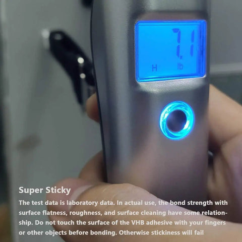 Close-up of digital scale displaying 7.1 lb with hand holding it, testing 40 Pack Cable Clips With Strong Adhesive Tape For Wire Organization.