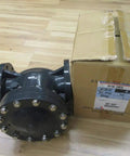 Rock Solid 4 Inch Swing Check Valve Hi PVC Body with EPDM seals next to its box on wooden floor.