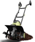 Electric Tiller Cultivator 14 Inch With Folding Handle, 12 Amp Corded Garden Rototiller on soil, steel tines visible