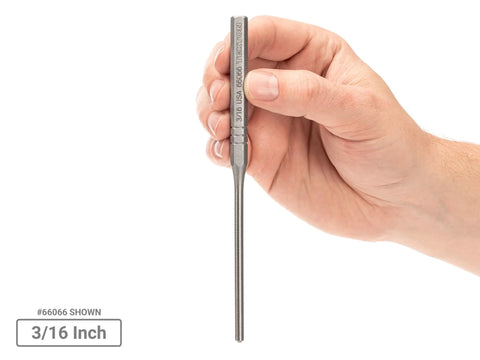 Hand holding 3/16 inch roll pin punch from the Roll Pin Punch Set Eight Piece One Sixteenth To One Quarter Inch Hollow Pin Drivers For Driving Out And Installing Pins, Pro Grade Precision Machined Steel, Built For Automotive Garage And DIY Projects Made In USA.
