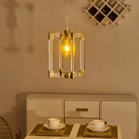 Gold Pendant Light Fixture With Brushed Brass Finish, 1 Light Modern Linear Chandelier illuminating a dining setting.