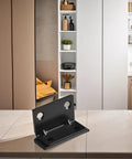 Stainless Steel Magnetic Cabinet Latch With No Slam Hold for thin doors shown in a kitchen setting.