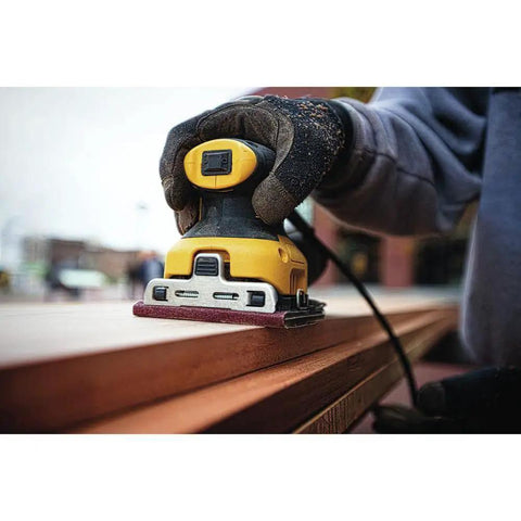 Person using Beast Electric Sander 1/4 Sheet With 14,000 OPM And 2.3 Amp Motor, Rubber Overmold Handle with improved paper clamp on wood