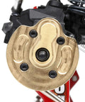 Close-up of brass portal steering knuckle for Axial SCX10 III Capra 1.9, showing detailed finish and installation on RC crawler.