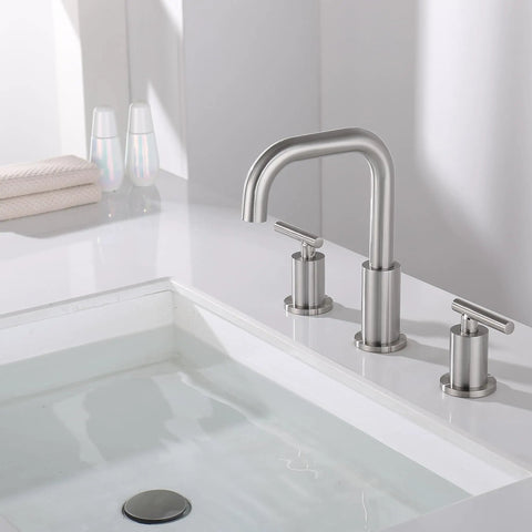 8 Inch Brushed Nickel Widespread Bathroom Faucet With Two Handles, 3 Hole Mount, SpotShield Finish on white countertop