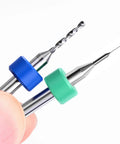 Close-up of two drill bits from 10 Pcs PCB Drill Bit Set With One Eighth Inch Shank Micro Twist Carbide Bits 1.1mm To 2.0mm For PCB Engraving.