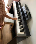 Universal Sheet Music Stand With Silicone Gasket Kit For Wide Slot Keyboards on electric keyboard with child playing