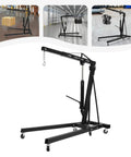 Professional Grade 2 Ton Folding Engine Hoist With Electric Winch And Six Smooth Rolling Caster Wheels For Garage Motor Swap Rigs and Auto Jobs Made From Tough Carbon Steel that Handles Heavy Loads Without Breaking A Sweat in a workshop.