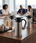 Boss Level 24v Electric Water Kettle For Truckers And Road Warriors 750ml Stainless Steel Portable Travel Heater Bottle displayed on a conference table.