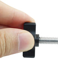 Close-up of 4 Pack Stainless Steel Thumb Screws With Black Aluminum Knobs 1/4-20 x 3/4 Inch Tee Wing Hardware held in hand.
