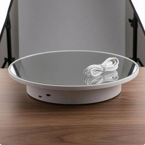 Stunning Mirrored Gold Electric Turntable For Jewelry And Accessories on a wooden table with USB cable.