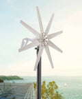600W Wind Turbine Generator Kit 12V With 8 Blade Design Durable Nylon Blades Charge Controller Included Wind Power Generator For Marine And Home Use Hybrid Solar Wind System Ready installed on a pole by the sea