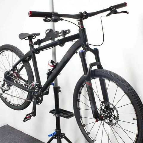 Bicycle with Air MTB Suspension Fork With Rebound Adjustment For 26 27.5 29 Wheels, 120mm Travel, Black, displayed on a stand.
