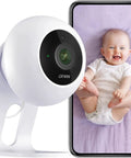 2K Indoor Security Camera With 2 Way Talk And Motion Alerts, QHD Pet Monitor, 2.4GHz WiFi, Crystal Clear IR Night Vision next to phone