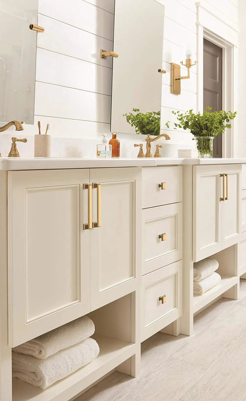 Champagne Bronze Cabinet Pull In Traditional Style With Overall Length 5-13/16 Inches And Center-To-Center 5-1/16 Inches Appoint Series Drawer Handle shown on cream bathroom cabinets