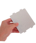 Person holding a microwave waveguide cover mica sheet replacement for ovens with high heat resistance and insulation board.