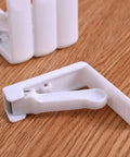 Close-up of 12 Pcs Plastic Spring Tablecloth Clips For Outdoor Tables No Slip Grip Easy Clamp Table Cloth Holders in white