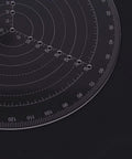 Close-up of VISLONE clear acrylic round center finder compass with circle gauge for drawing circles on wood turning.