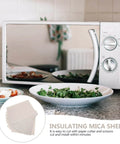 Microwave with Heat Resistant Mica Flakes Set for Waveguide Covers and Oven Insulation displayed on kitchen counter