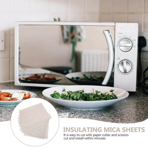 Microwave with Heat Resistant Mica Flakes Set for Waveguide Covers and Oven Insulation displayed on kitchen counter