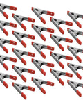 Pack of 24 heavy duty 4 Inch Metal Spring Clamps with red PVC coated handles and tips for quick grips in woodworking and DIY projects