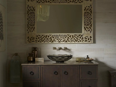 Kohler Jacquard Ring Pull in black finish on dark wood vanity with mirror, showcasing corrosion and tarnish resistant hardware.