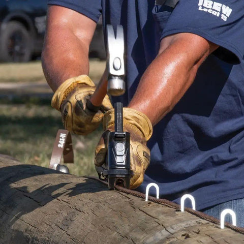Worker using Beefy Heavy Duty Staples for Ground Wire and Molding Installations with Utility Staple Starter STP100