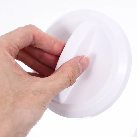 Close-up of hand gripping Super Cool Sosoport Switch Knob For Vending Machines And Playgrounds Sturdy Plastic party game accessory.