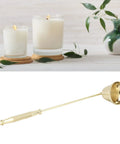 Slick Stainless Steel Candle Snuffer With Ergonomic Long Handle And Hassle Free Wick Control For Tapered Dinner Candles And Fresh Home Decor Setup In Classic Gold Finish next to lit candles.