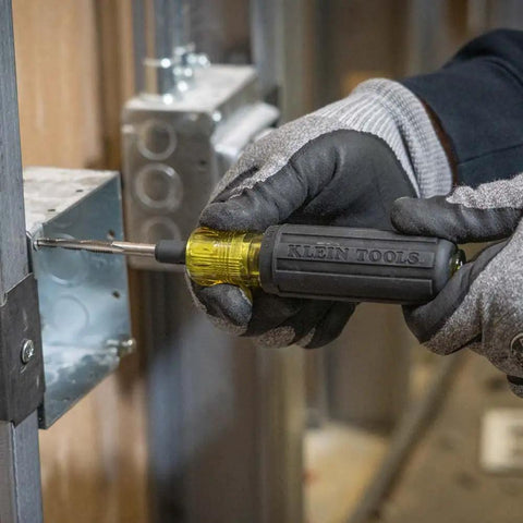 Worker using 6 In 1 Tapping Tool From Klein Tools With Cushion Grip For Repairing And Cleaning Threads Auto Re-Threads To Next Size If Stripped