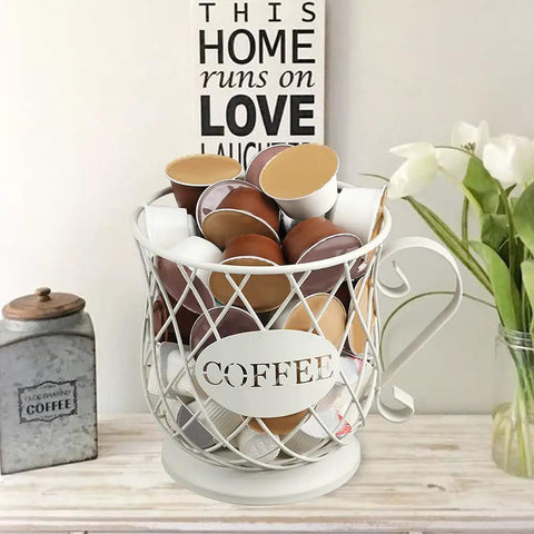 White Wire K Cup Storage Organizer For 35 Pods placed on kitchen counter with coffee pods inside, next to decor.