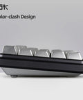 Compact 60 Percent Wired Mechanical Keyboard With Full Metal Chassis And Hot Swappable Red Switches Providing Customizable Rgb Lighting For Pc Gamers Wanting A Straight Durable Rig Upgrade That Is Totally Dialed In, side view showcasing silver keys.