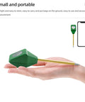 Person holding 5X Mini Soil Moisture Meter With Light And PH Tester for Quick Garden Care, showcasing compact handheld size.